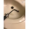 American Home Shield [AHS] - ac service caused my faucets to overflow/plumbing uncovered