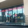 Sally Beauty Supply - employees smoking at entrance